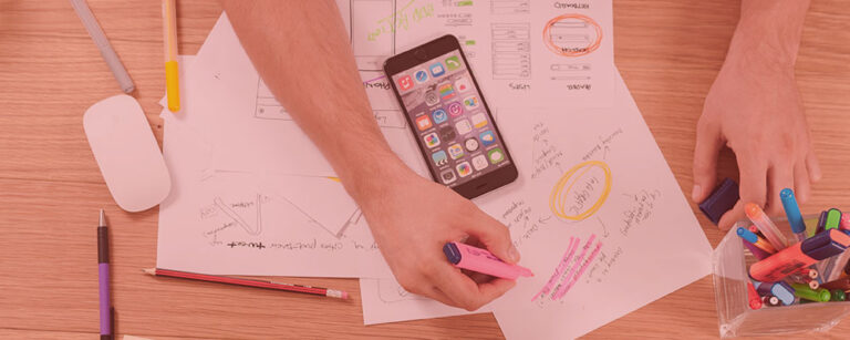 person layout out their marketing research process on paper