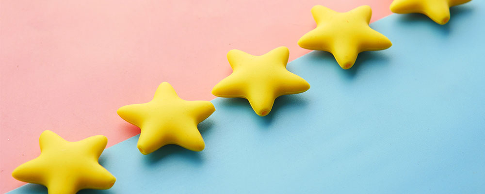 reasons why you need social proof. Image of stars on a colored background.