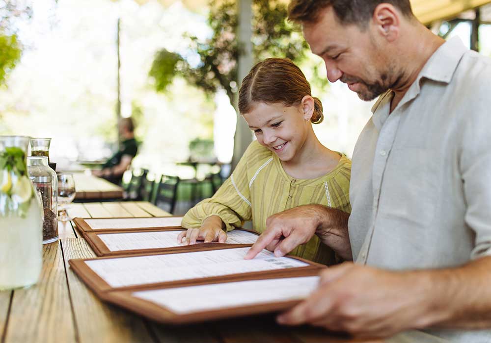 father and daughter looking at simple to read menu enhancing user experience