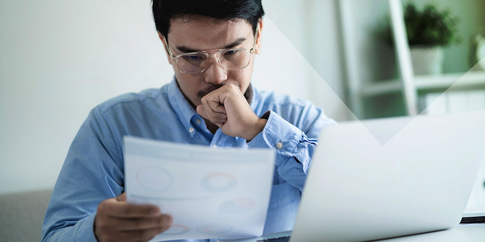 The image depicts a professional analyzing website analytics on multiple computer screens, focusing on search engine rankings and SEO strategies. The screens display various metrics related to website traffic, search visibility, and the effectiveness of ethical SEO practices in improving online reputation.